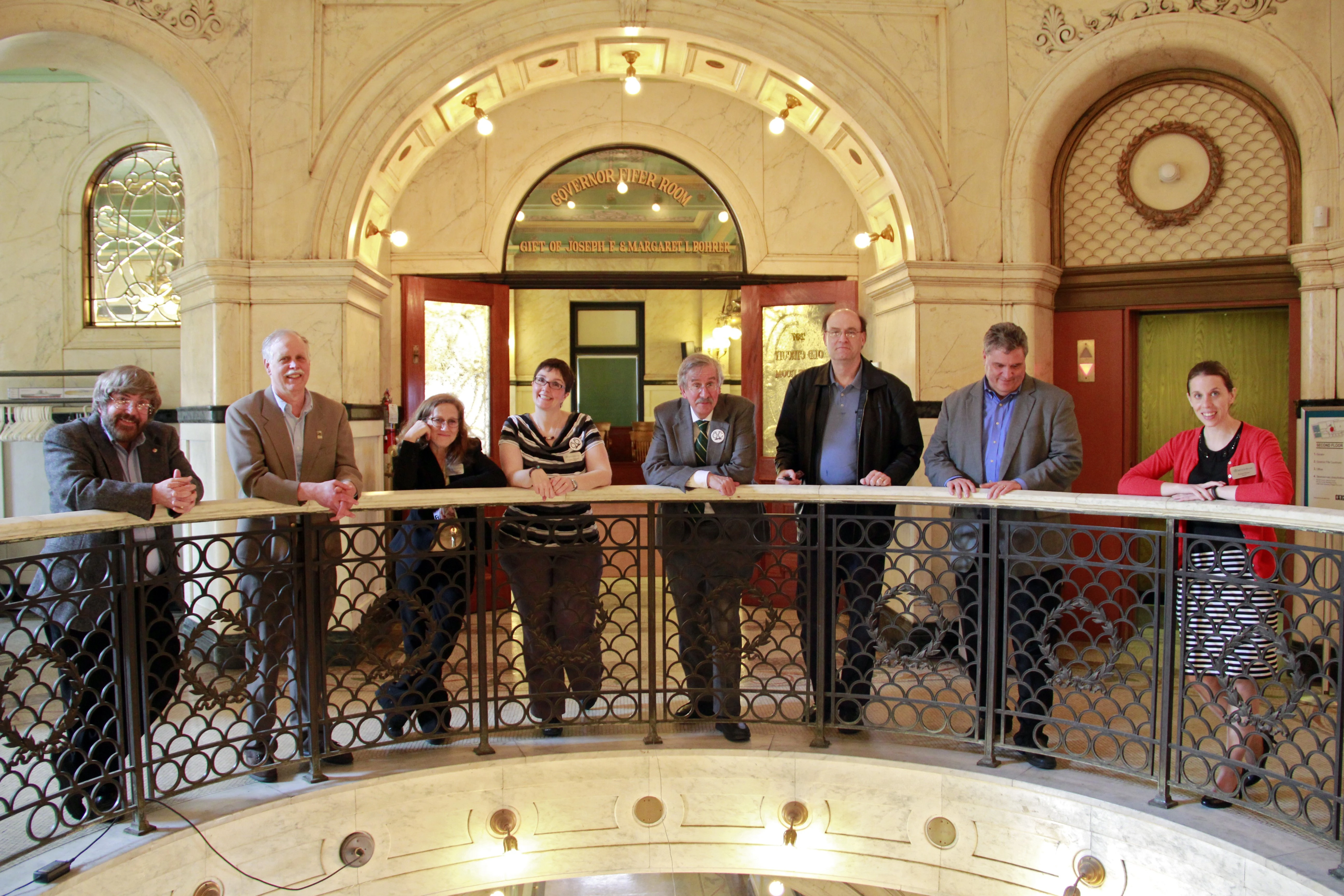 Museum staff and volunteers pose for a photo in the Rotunda.