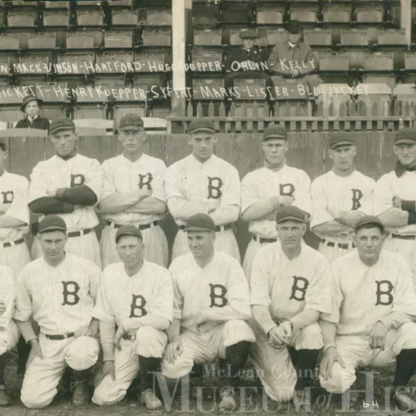 The Bloomington Bloomers pose for a team photograph at Fans Field during their 1919 pennant-winning Three-I League season.