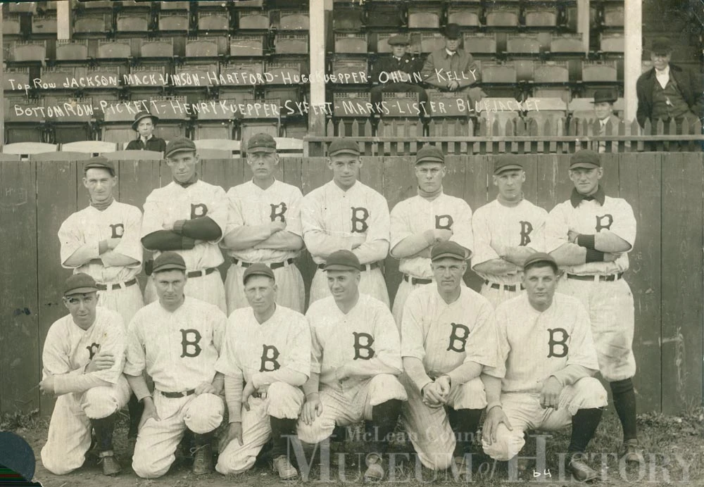The Bloomington Bloomers pose for a team photograph at Fans Field during their 1919 pennant-winning Three-I League season.