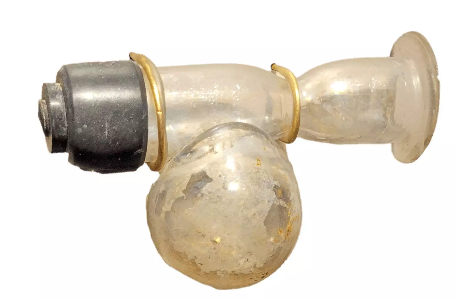 Glass tube with a metal end on the left side. There is a round bulb at the bottom.