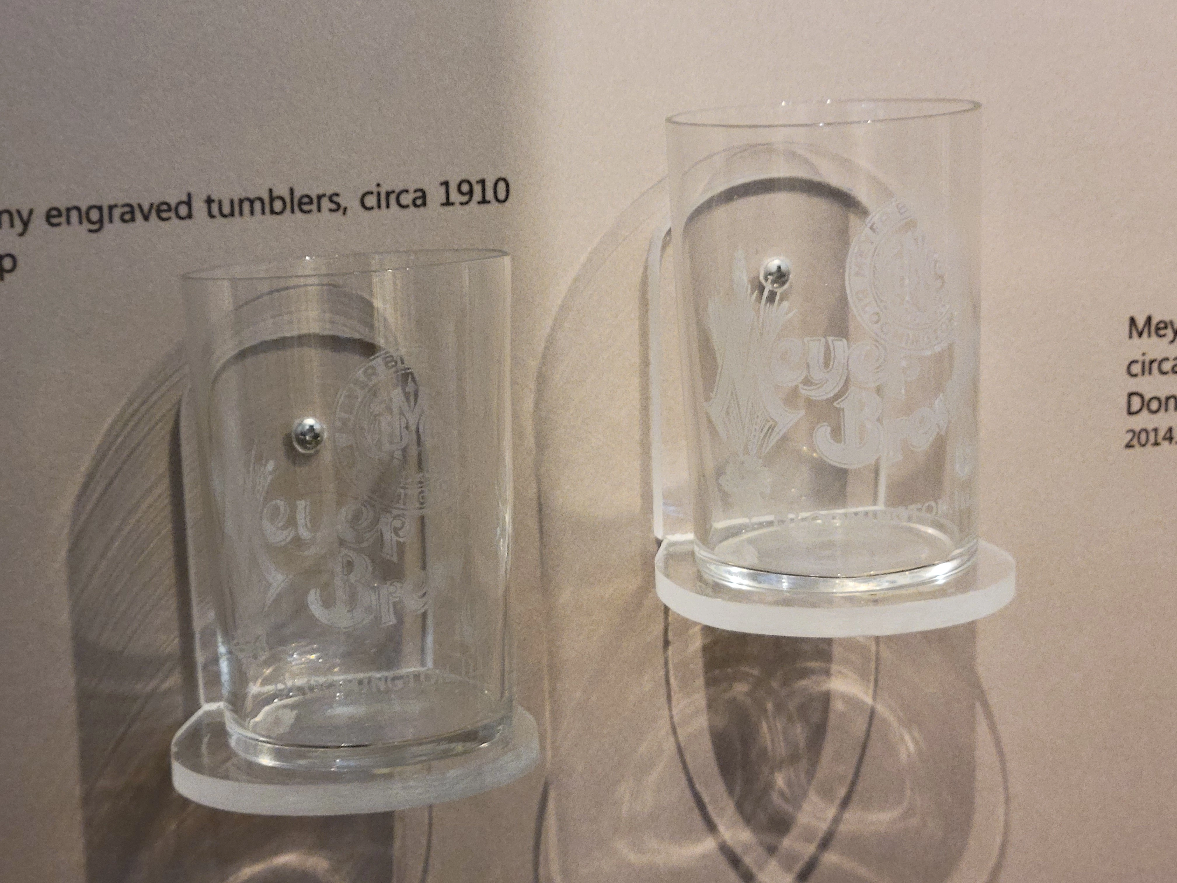 Two clear cylindrical glasses engraved with Meyer Brewing in white lettering.
