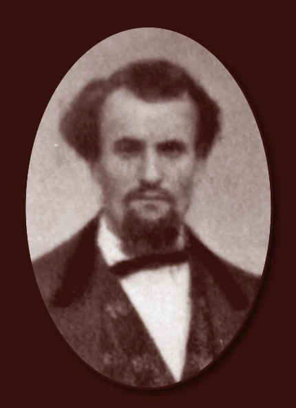 a fuzzy image of a light-skinned man with somewhat unkempt hair and a goatee.