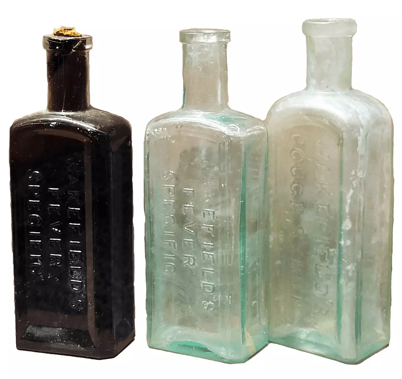 Three small bottles with necks, no labels.