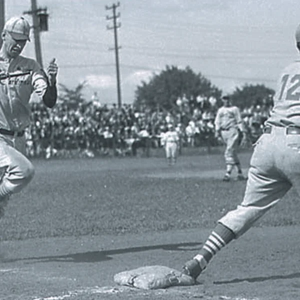 shortstop Bing Cosbey attempting to beat out a second-inning grounder