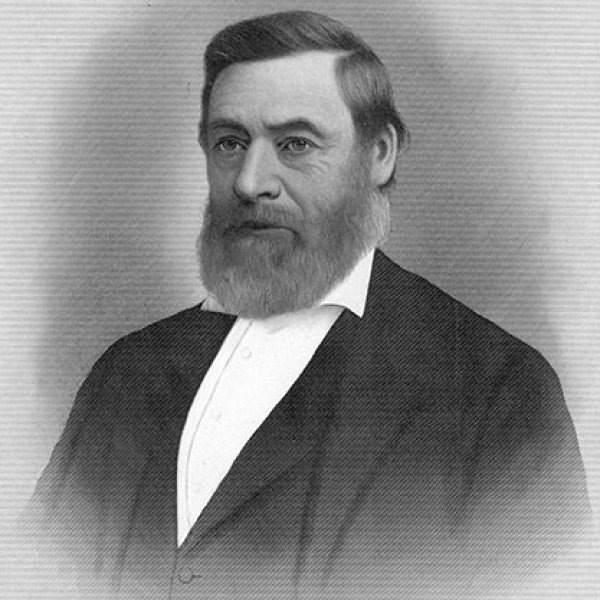 Portrait of Linus Graves, a middle-aged man wearing a white collared shirt, vest, and jacket, with full beard and large nose.