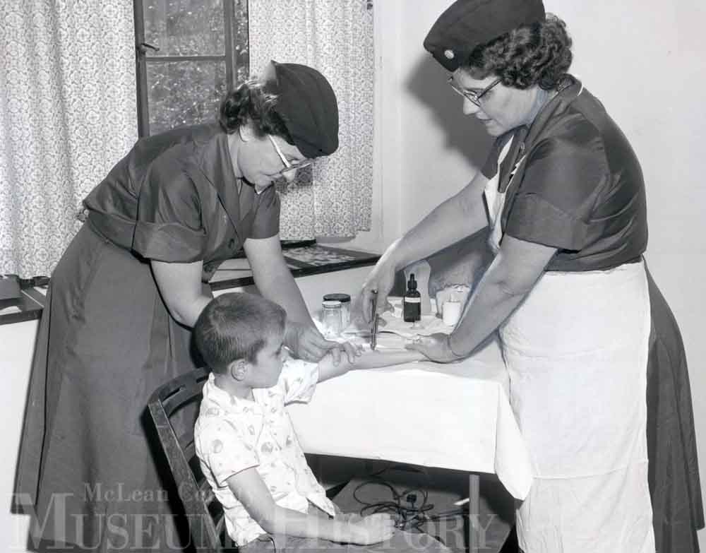 Young boy receiving vaccination, 1962.