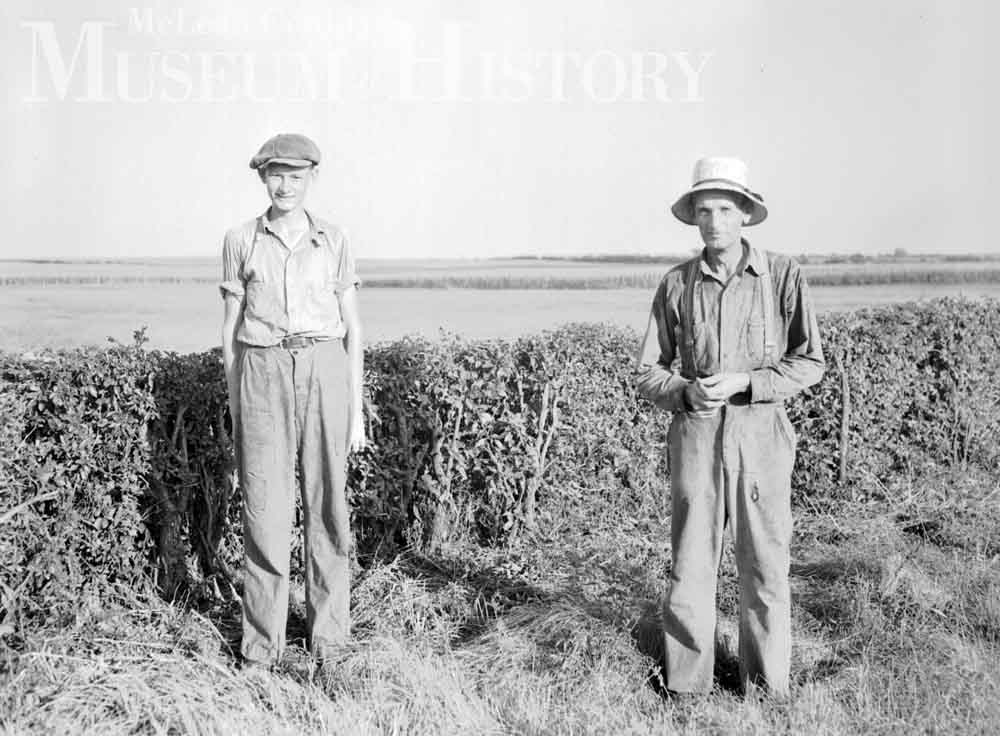 ​Farmer Joel Yordy and his son Willard, 1938.